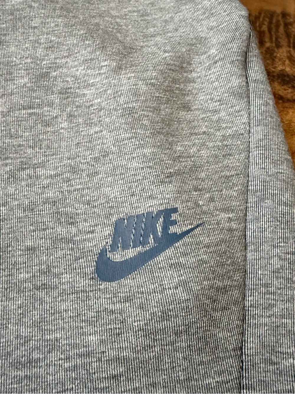 Gray Nike Tech Fleece Joggers with black side stripe
